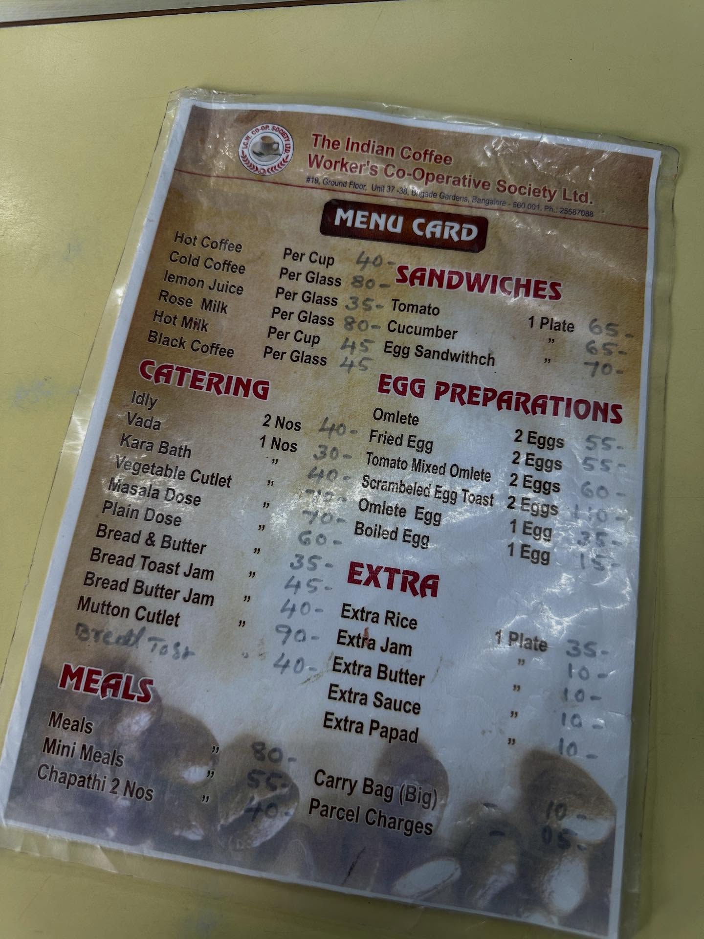 、「ATERING egetable table Cutlet asalaDose Dose Dose Butter Toast Jam Jam Cutlet ア日St MEALS Worker'sCo-O TheIndianCoffee MENA MENUCARD CARD SANDWICHES ucumber Sandwithch EGG PREPARATIONS Omlete 30- Tomato Mixed Omlete 2Eggs Egg 2Eggs 55- Scrambeled Egg Toast 2Eggs 60 Omiete Egg စေ- Boiled Egg Egg 35- EXTRA 45 40- ExtraRice Extra Rice 70- ExtraJam Extra Jam 40- ExtraButter Extra Butter Extra ExtraSauce Sauce ExtraPa」というテキストの画像のようです