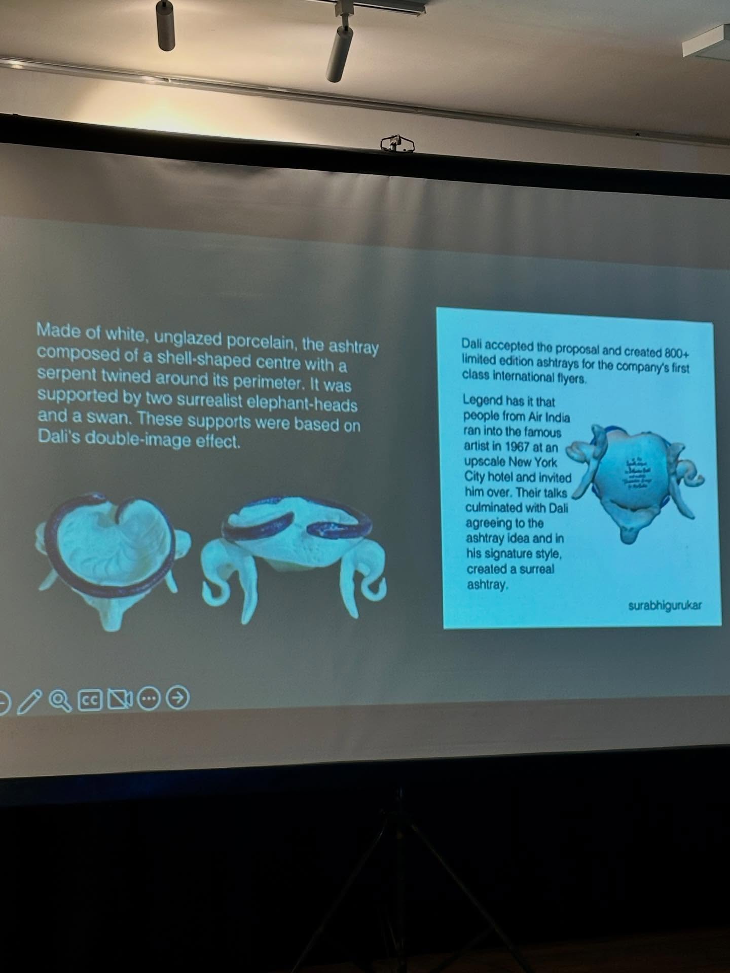 、「Made of white, unglazed ung porcelain, the ashtray composed shell-shaped centre with a serpent twined around perimeter. supported was two surrealist elephant-heads and swan. These supports were based on Dali's S double-image effect. ፍናች 一0四0日 accepted the proposal limited created 800+ ashtrays the he company's first class International Legend that fromA India ran into the lamous atan upscale nvited him over, Their culminated Dali agreeing the ashtray andin signature created surreal ashtray. surabhigurukar」というテキストの画像のようです